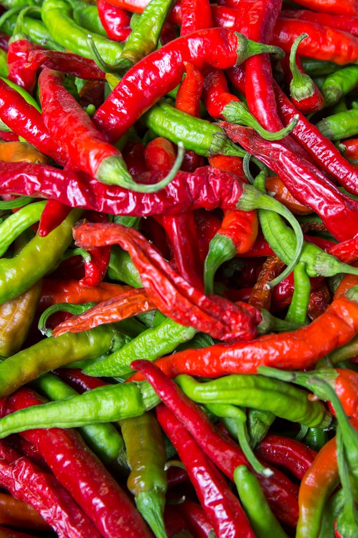 why-choose-us Close-up of vibrant red and green chilies showcasing freshness and spice.